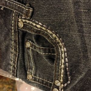 Blue jeans with white blouse